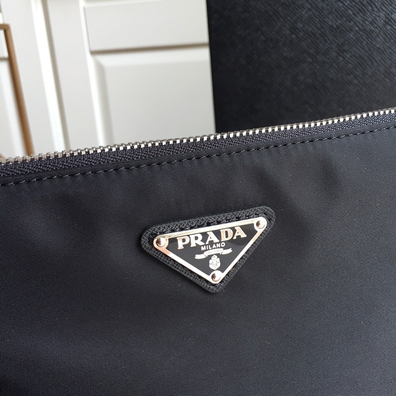 Pra*a clutch bags